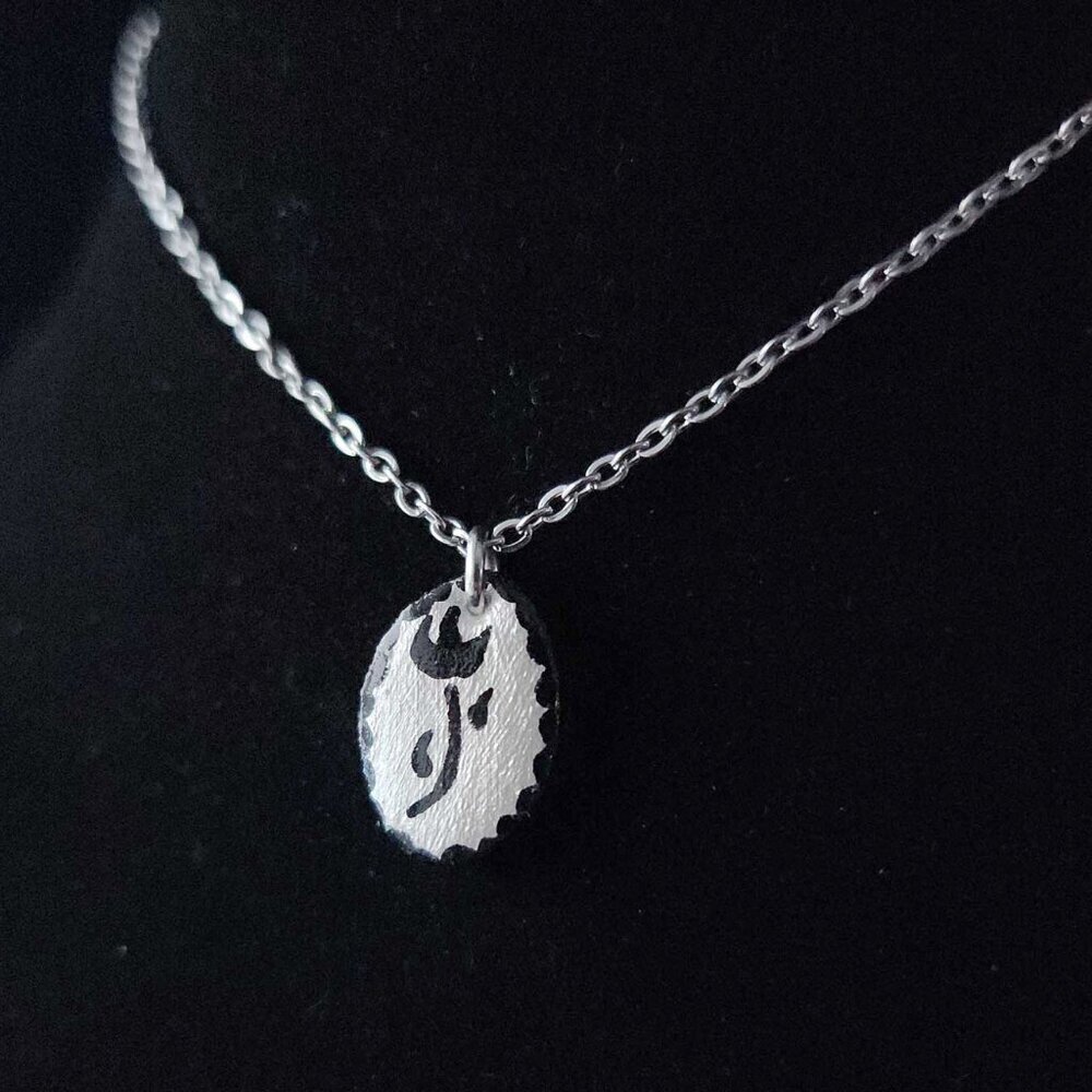 Dainty iridescent flower necklace with a small silver chain